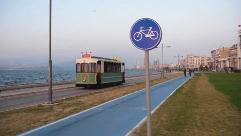 Sightseeing Retro Tram Passing Along The Seafront Of The Big City In The Evening Stock Footage 195929651