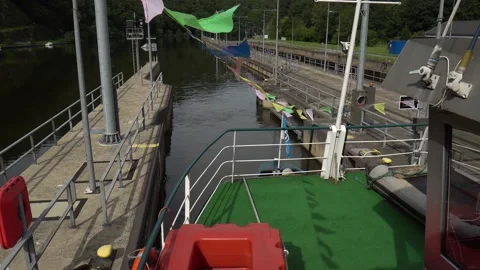 Sightseeing ship is leaving the sluice at the Saar river loop Stock Footage 131383792