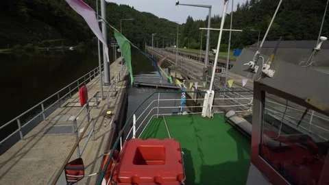 Sightseeing ship waits for exiting the sluice at the Saar river loop Stock Footage 131382055