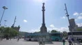 Sightseeing tour buses parked at the Columbus Monument in Barcelona 4k or 4k+ Resolution