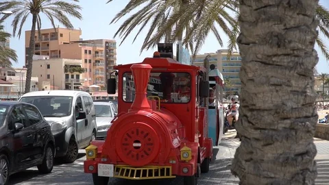 Sightseeing train in the city Stock Footage 128349192