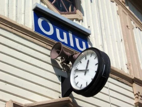 Sign and clock in Oulu Stock Photos