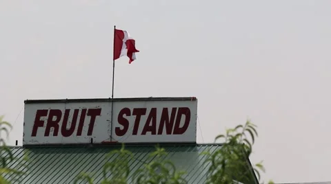 Sign and Flag over Fruit Stand Stock Footage 52305530