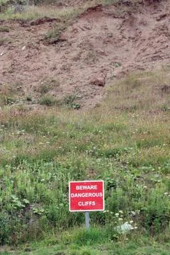 Sign beware dangerous cliffs Stock Photos