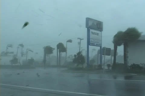 A sign is blown apart by hurricane winds Stock Footage 12575302