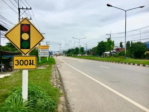 Sign board alert trafic light  at junction Thailand. translate to English "30 Stock Photos