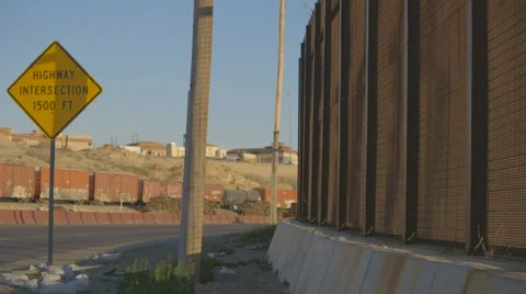 Sign by Border with Train Passing by in the Background Stock Footage 60119436