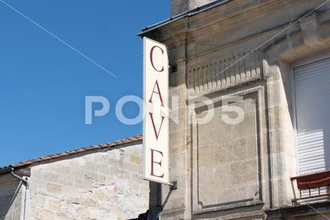 Sign on building indicating cave means wine cellar vendor in French in Margau Stock Photos