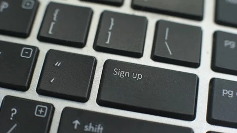 Sign up button on computer keyboard, female hand fingers press key Stock Footage 97827800