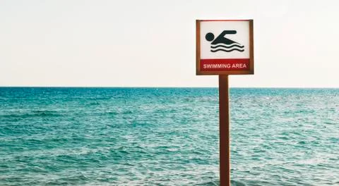 Sign can float on the sea beach Stock Photos