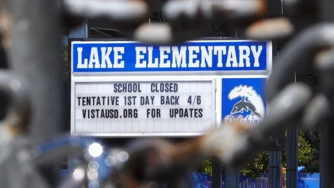 Sign of closed down elementary school Stock Footage 126562650