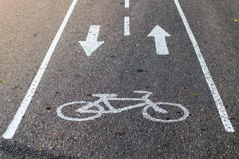 Sign of cycle path on the road Stock Photos