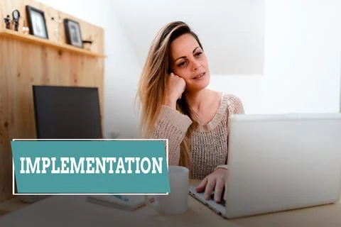 Sign displaying Implementation. Business concept The process of making something Stock Photos