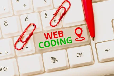 Sign displaying Web Coding. Concept meaning a system of symbols and rules used Stockfoto's