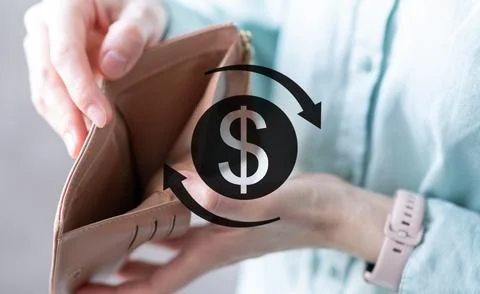 The sign of the dolar against the background of an empty wallet in the hand.. Stock Photos