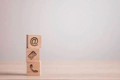 Sign of e-mail , address and telephone carved on wooden block cube Stock Photos