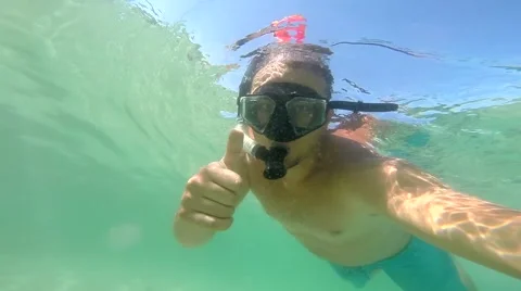 The sign everything's okay underwater. Diving Suit Swims Underwater In Sea Stock Footage 67828833