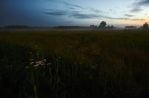 A sign in a field Stock Photos