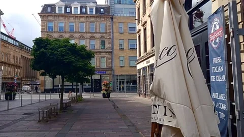 A sign flapping in the wind near a restaurant Stock Footage 200262292