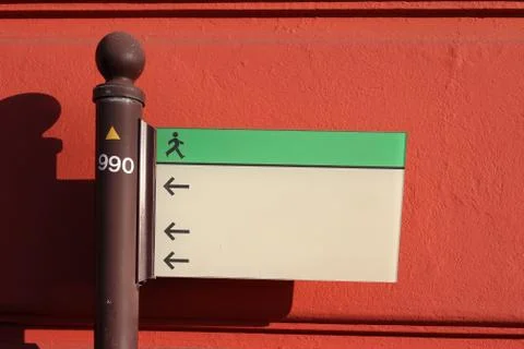 Sign in front of a red wall Foto stock