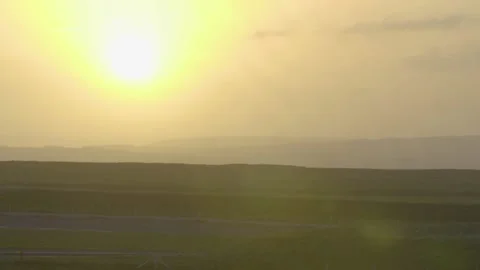 A sign in front of a sunset Stock Footage 156012449