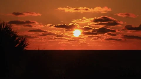 A sign in front of a sunset Stock Footage 156013006