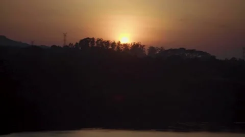 A sign in front of a sunset Stock Footage 156024436