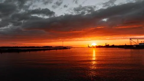 A sign in front of a sunset Foto stock