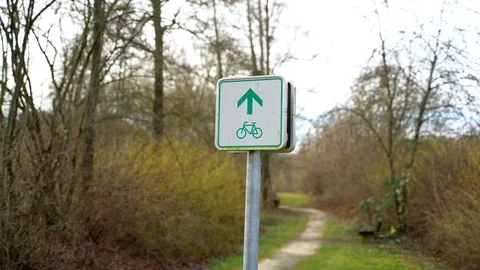 Sign indicating cycle path between vegetation, Heuchlingen, Germany. Stock Footage 102646130