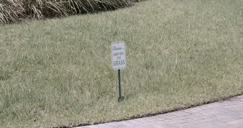 A Sign On The Lawn Saying Please Keep Of The Grass Stock Footage 92187792