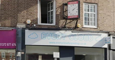 Sign To Let above an empty shop which is being refurbished, camera tilts down Stock Footage 149222611