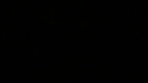 A sign lit up at night 库存影片 157862565