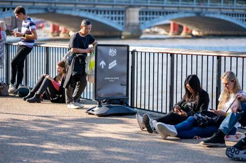 A sign for the Lying in State queue along the South Bank of the River Thames Stock Photos