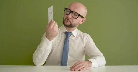 Sign Up  - A man presents a note with the word Stock Footage 267088825