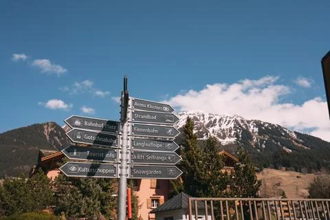 A sign with a mountain in the background Stock Photos