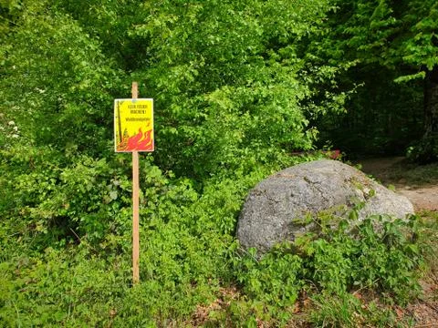 Sign with note: Do not light a fire! Forest fire risk. Stock Photos