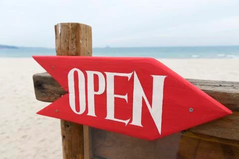 Sign Open on the Beach Stock Photos