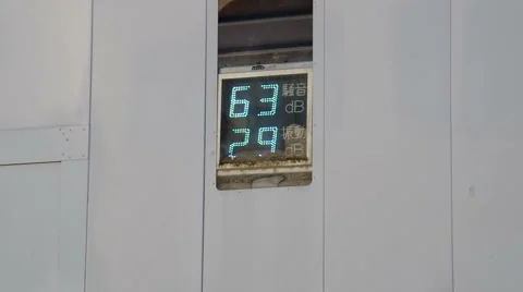 Sign outside of a construction site showing the decibel levels inside and out Stock Footage 43191564