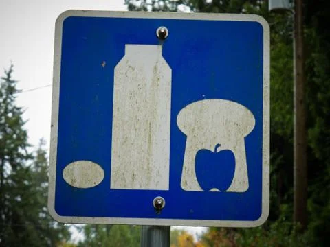 Sign picturing basic food milk bread apple and egg Stock Photos