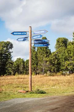 Sign-pointer directions and distances to cities Stock Photos