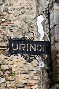 Sign for public urinal in the Alfama district, Lisbon. Portugal Stock Photos
