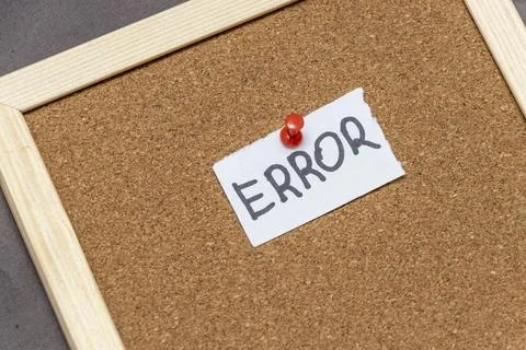 A sign reading ERROR pinned to a cork board. This image symbolizes mistakes and Stock Photos