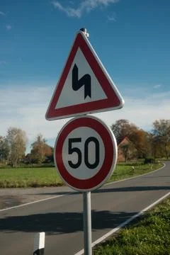 A sign with a red and white triangle and the number 50 on it Stock Photos