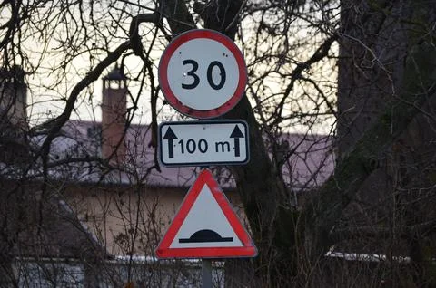 A sign with a red arrow pointing up. Stock Photos