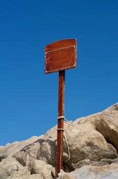 Sign on rocks Stock Photos