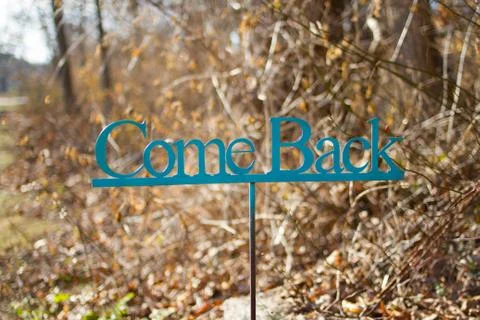 Sign saying Come Back 스톡 사진