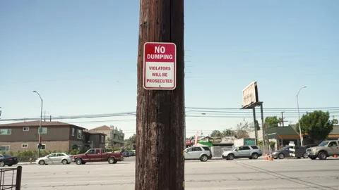 A Sign Says “No dumping. Violators will be prosecuted.” 스톡 동영상 151183257