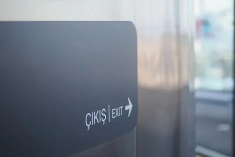 Sign showing exit direction in modern building Stock Photos