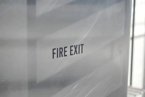 Sign showing fire exit in a building Stock Photos