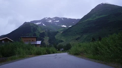 A sign on the side of a mountain road 動画素材 156011826
